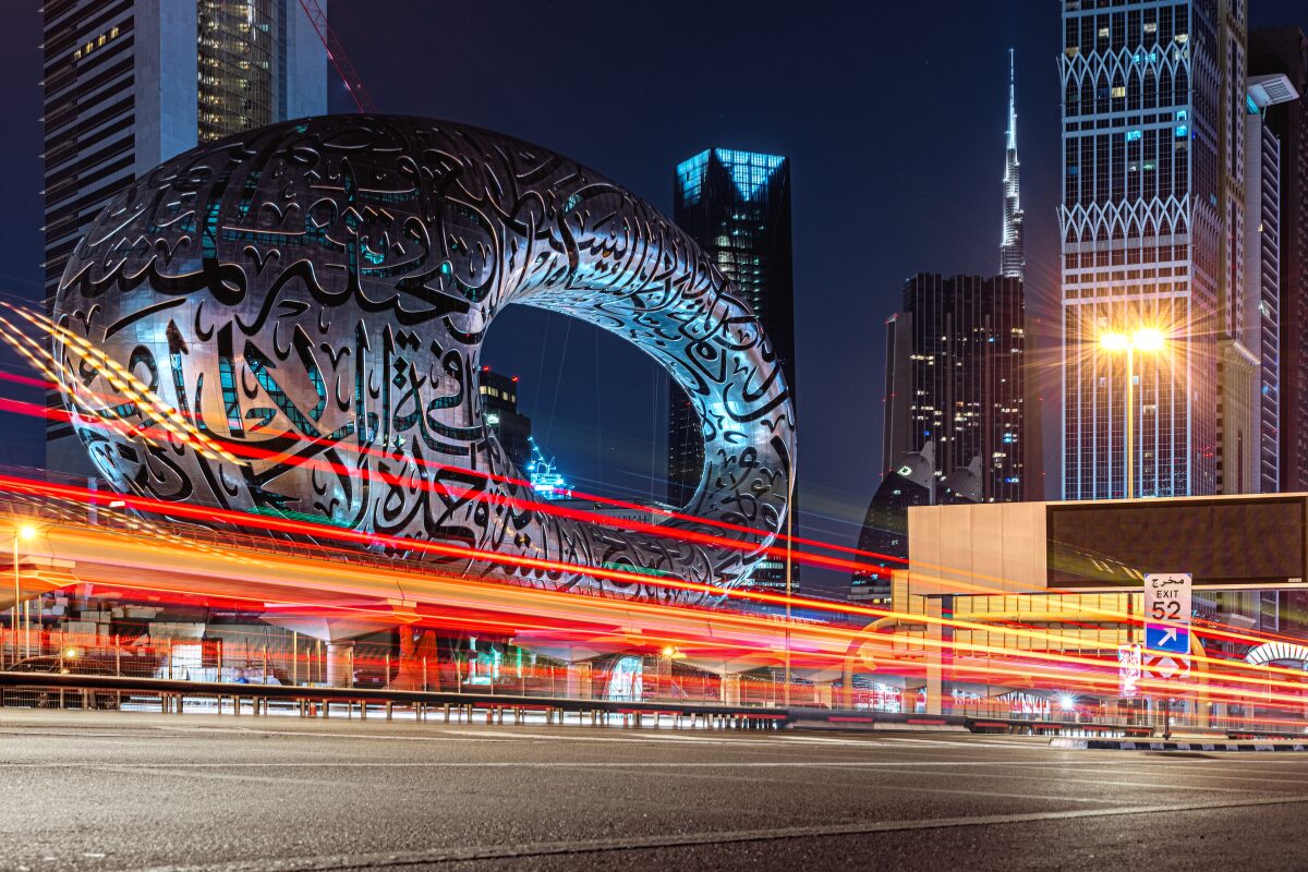 Night view of Dubai’s Museum of the Future with light trails showing the energy of the Dubai global business hub